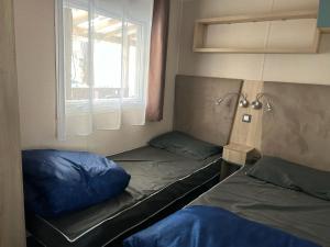 a room with two beds and a window at Bonne anse plage in Les Mathes +8 photos