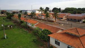 an aerial view of a town with orange roofs at Pousada Os Galeguinhos in Santa Cruz do Rio Pardo