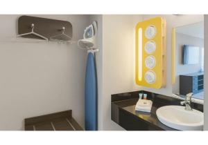 a bathroom with a sink and a mirror at Motel 6-Anaheim, CA - Maingate in Anaheim