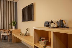a room with a counter with a coffee maker on it at beminimal jardines in Medellín +57 photos