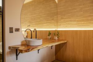 a bathroom with a sink and a mirror at beminimal jardines in Medellín