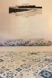 two pillows are sitting on the floor in a room at Canto da Onda - Trilha exclusiva para a praia in Marechal Deodoro