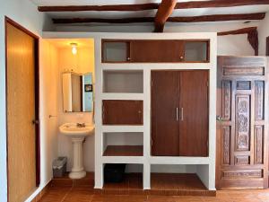 a bathroom with a sink and a toilet in it at Choby's House Holbox in Holbox Island
