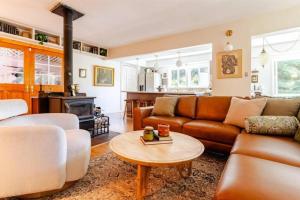 a living room with a couch and a table at Evergreen Escape in Felton