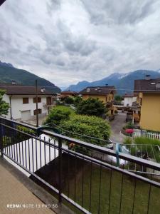 a balcony with a view of a town with mountains at Casa In Fiore in Mese