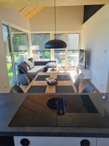 a living room with a couch and a table at 5lakes & nature in Starnberg