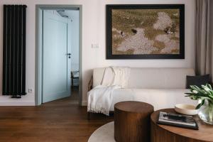 a living room with a couch and a table at Nowy Sącz Apartamenty in Nowy Sącz
