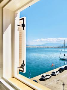 a window with a view of the water at Sea Sparkle 1b in Preveza