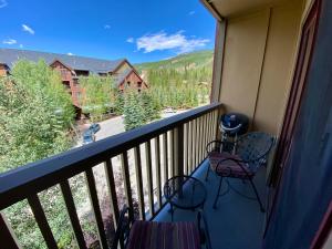 a balcony with chairs and a view of a mountain at Red Hawk Lodge 2297 by SummitCove Lodging in Colorado in Keystone +48 photos