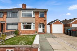 a brick house with a white door and a driveway at Great Sutton House Perfect for Contractors in Sutton