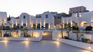 a view of the exterior of a building with lights at Maiandros Suites in Karterados