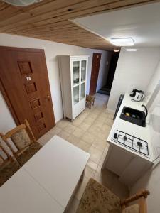 a kitchen with a stove and a counter top at Kaštieľ Fričovce in Fričovce