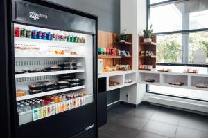 a refrigerator filled with lots of food and drinks at Hôtel Alt Québec in Quebec City +15 photos