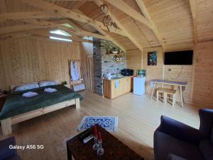 a large room with a bed and a kitchen at savane mukhranshi in Mukhrani