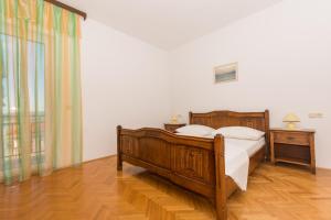 Ein Bett oder Betten in einem Zimmer der Unterkunft Apartmani Gaube
