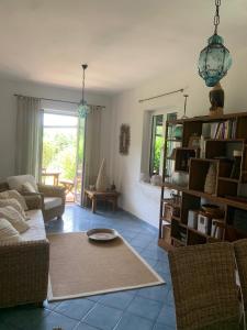 a living room with a couch and a table at Villa 4 Rose in Sant'Angelo D'Ischia
