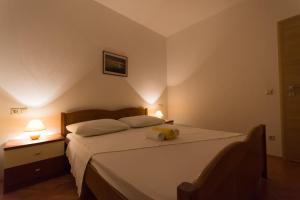 Ein Bett oder Betten in einem Zimmer der Unterkunft Apartmani Gaube