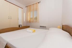 Ein Bett oder Betten in einem Zimmer der Unterkunft Apartmani Gaube