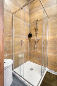a shower with a glass enclosure in a bathroom at St Julian s Luxury Laura Apartments in Is-Swieqi +38 photos