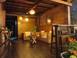 a living room with a couch and a table at Luma by Zakua in Guachaca