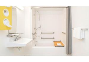 a bathroom with a shower and a sink at Motel 6-Carlsbad, CA Beach in Carlsbad