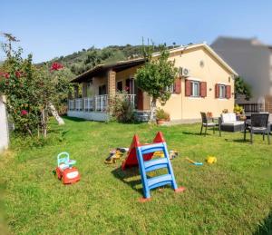 a group of toys in the yard of a house at Villa Marietta in Agios Gordios