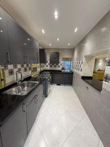 a large kitchen with a sink and a counter at Nile Royale Hotel in Cairo
