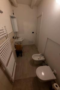 a bathroom with two sinks and a toilet in it at Acochì in Roccasparvera +10 photos