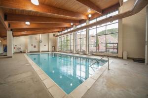 a large swimming pool in a large building at Pines 2167 by SummitCove Lodging in Colorado in Keystone