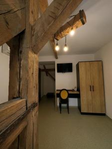 an office with a desk and a wooden wall at TimHouse in Timişoara