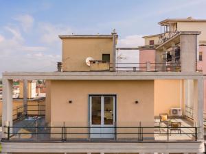 a view of a building with a balcony at Testa tra le Nuvole - Attico con Terrazza panoramica in centro in Novi Ligure