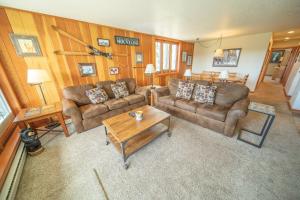 a living room with two couches and a coffee table at Pines 2147 by SummitCove Lodging in Colorado in Keystone