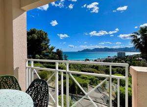 a balcony with a view of the ocean at Splendid view Apartment in Cannes in Cannes