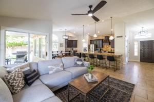 a living room with a couch and a table at Chandler Tyson in Chandler