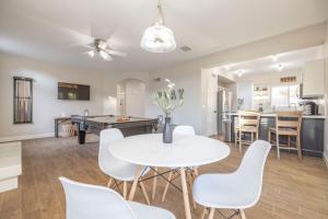 a dining room and living room with a table and chairs at Gilbert Douglas in Gilbert
