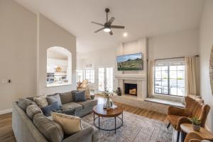 a living room with a couch and a fireplace at Gilbert Willow Tree in Gilbert