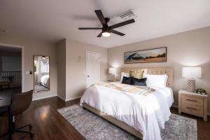 a bedroom with a bed and a ceiling fan at Gilbert Comstock in Gilbert +41 photos