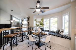 a dining room with a table and chairs at Gilbert Comstock in Gilbert