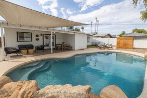 a swimming pool in front of a house at Gilbert East Laurel in Gilbert