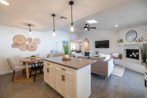 a kitchen and living room with a couch and a table at Gilbert East Laurel in Gilbert