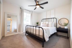 a bedroom with a bed and a ceiling fan at Gilbert East Laurel in Gilbert +31 photos