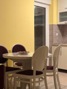 a dining room with a table and chairs at KMB suite in Nikšić +7 photos