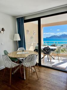 a dining room with a view of the ocean at Splendid view Apartment in Cannes in Cannes