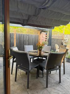 a table and chairs on a patio at Studio A - Newly renovated 2 bed studio in Nottingham +4 photos