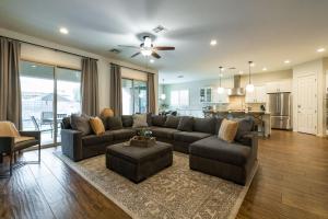 a living room with a couch and a table at Queen Creek on 193rd in Queen Creek