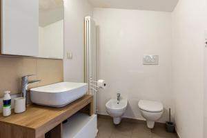 a bathroom with a sink and a toilet at Dimora Sant Anna in Piacenza +19 photos