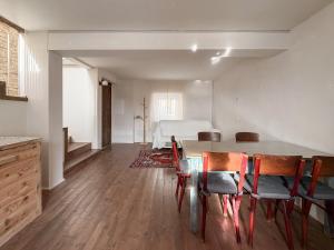 a room with a table and chairs and a bed at Ancona design apartment in Ancona
