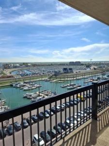 a view of a marina with boats in the water at Appartement Havenzicht Harbor View in Blankenberge