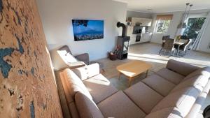 a living room with a couch and a table at Bauernhof Claussen Fehmarn in Fehmarn