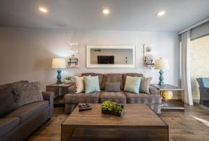 a living room with a couch and a table at Scottsdale Camelback in Scottsdale